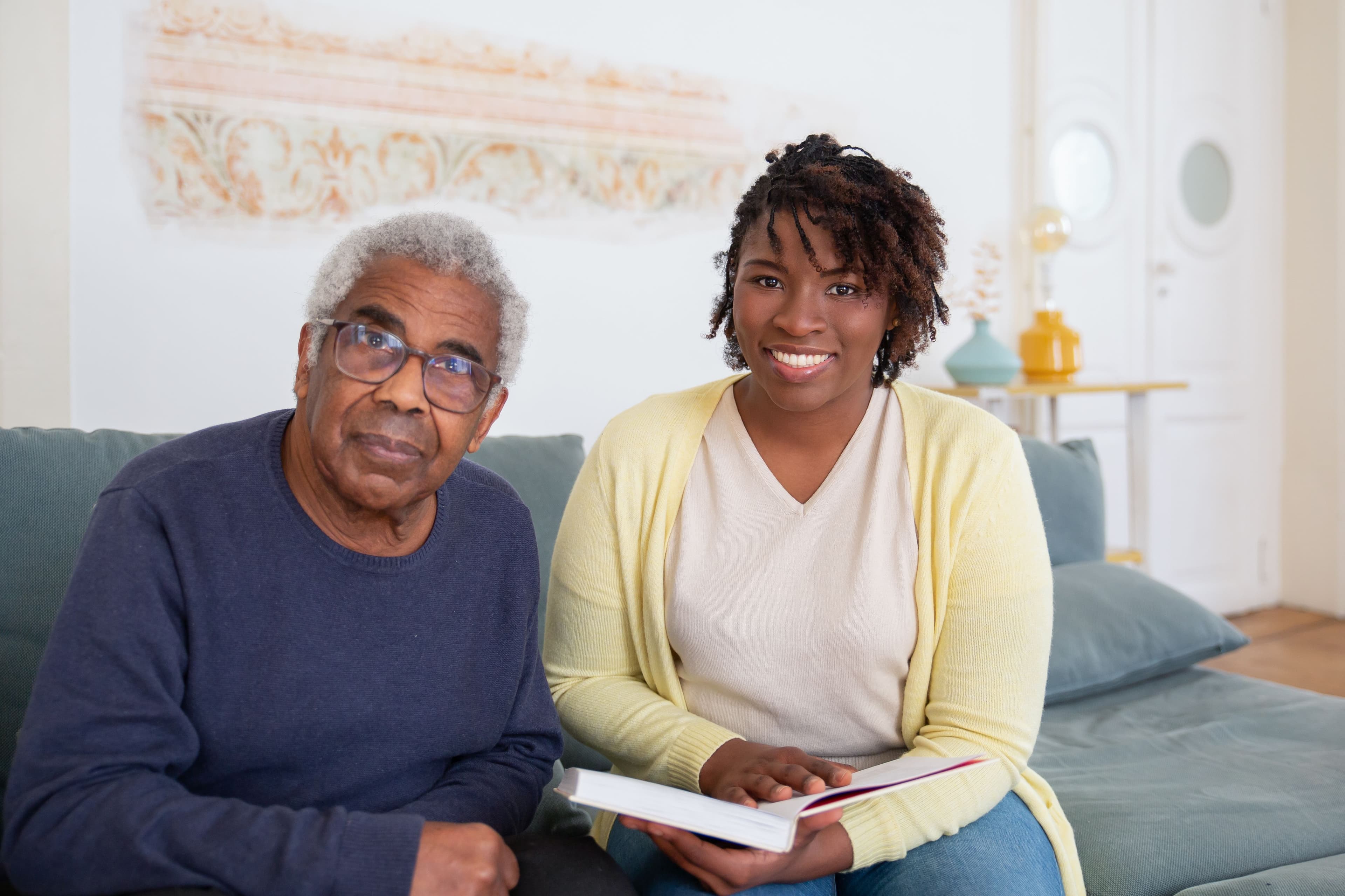 Caregiver spending time with a senior client at home